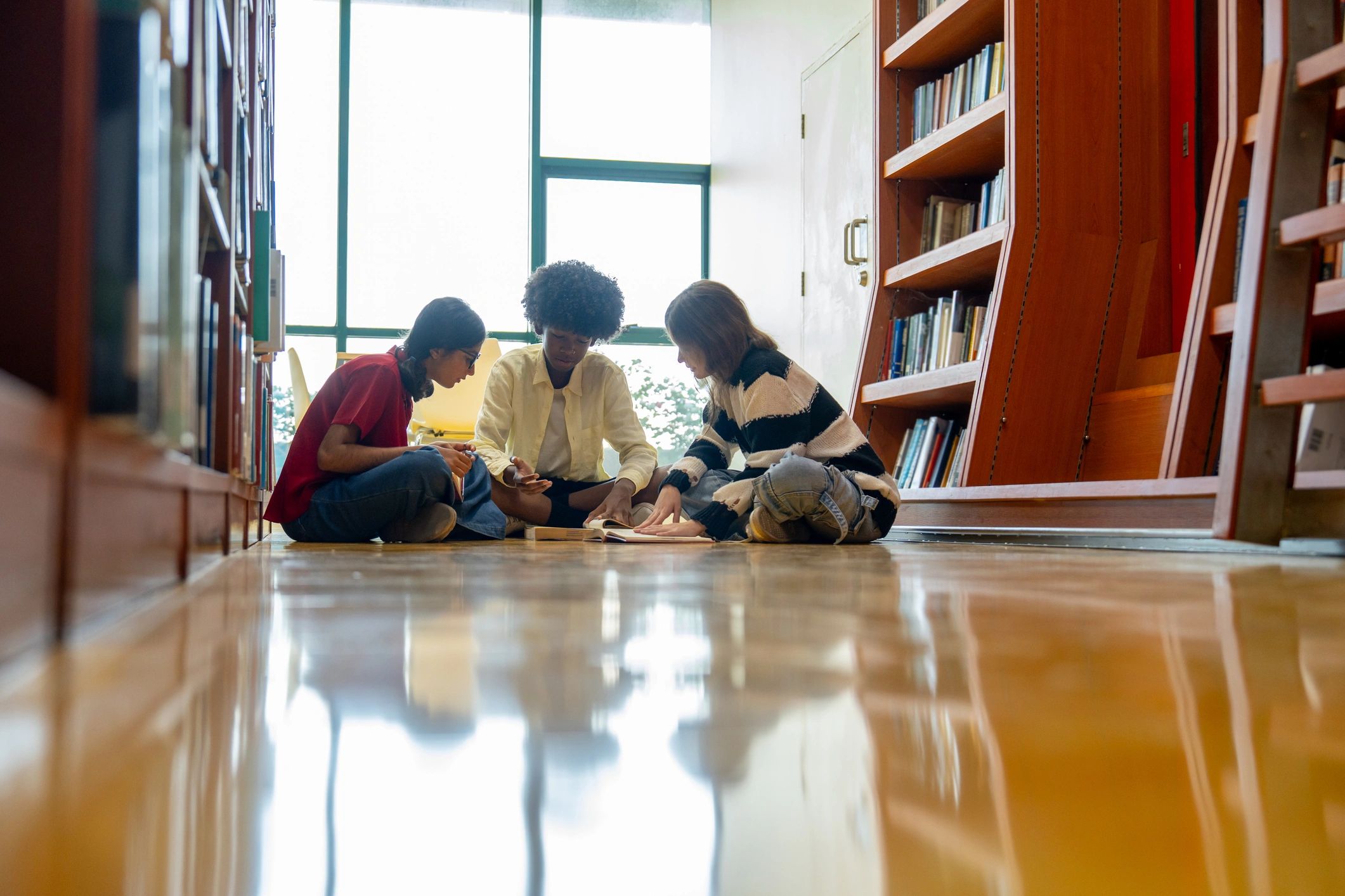 Students collaborating in a library learning space